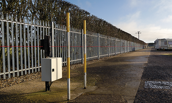 2 metre perimeter steel palisade fencing with Infrared beam alarms.